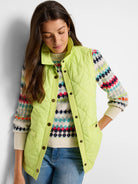 Lime green quilted puffer vest with a stand collar and dark bronze buttons.  Features pockets.