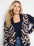 Navy blue cardigan with beige and brown leaf pattern.  Button front.