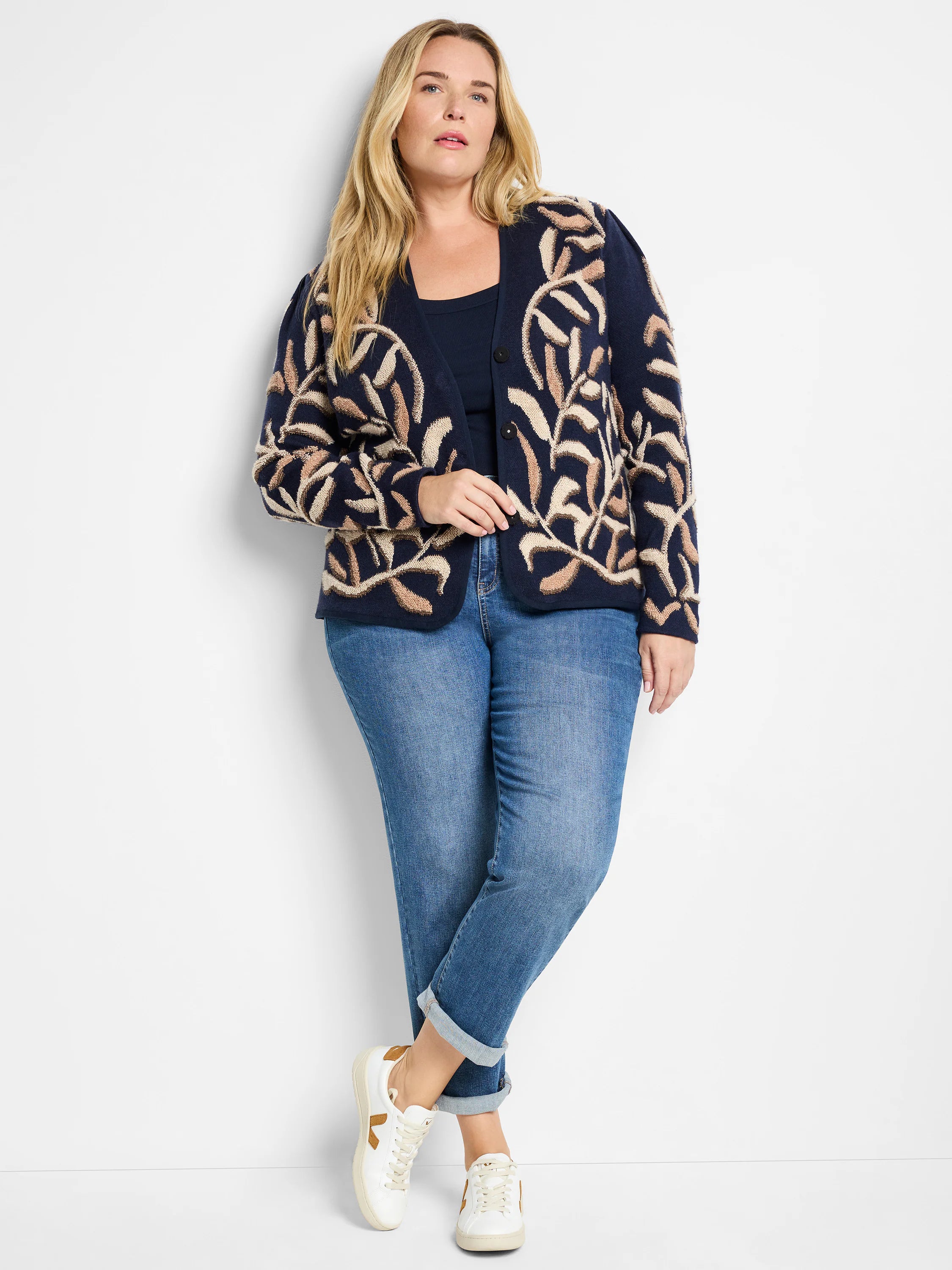 Navy blue cardigan with beige leaf pattern.  Button front.