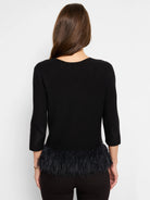 Black 3/4 sleeve sweater with a black feather fringe hem.