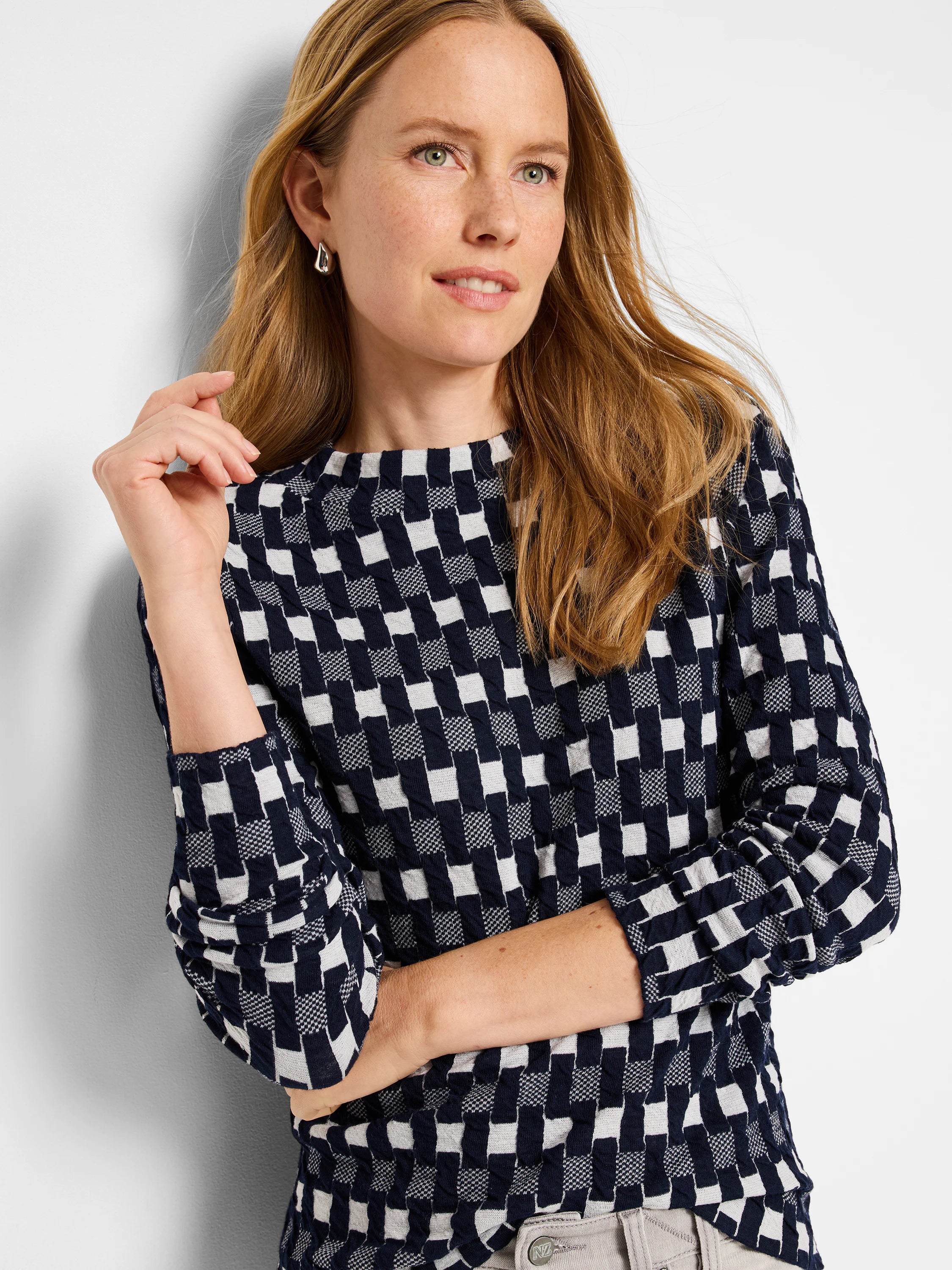 Navy and off-white textured sweater tee with a geometric,  checkered pattern. Three-quarter sleeves, crew neck.