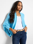 Light blue open cardigan, batwing sleeves, ribbed detail.  Model wears it over a white top.