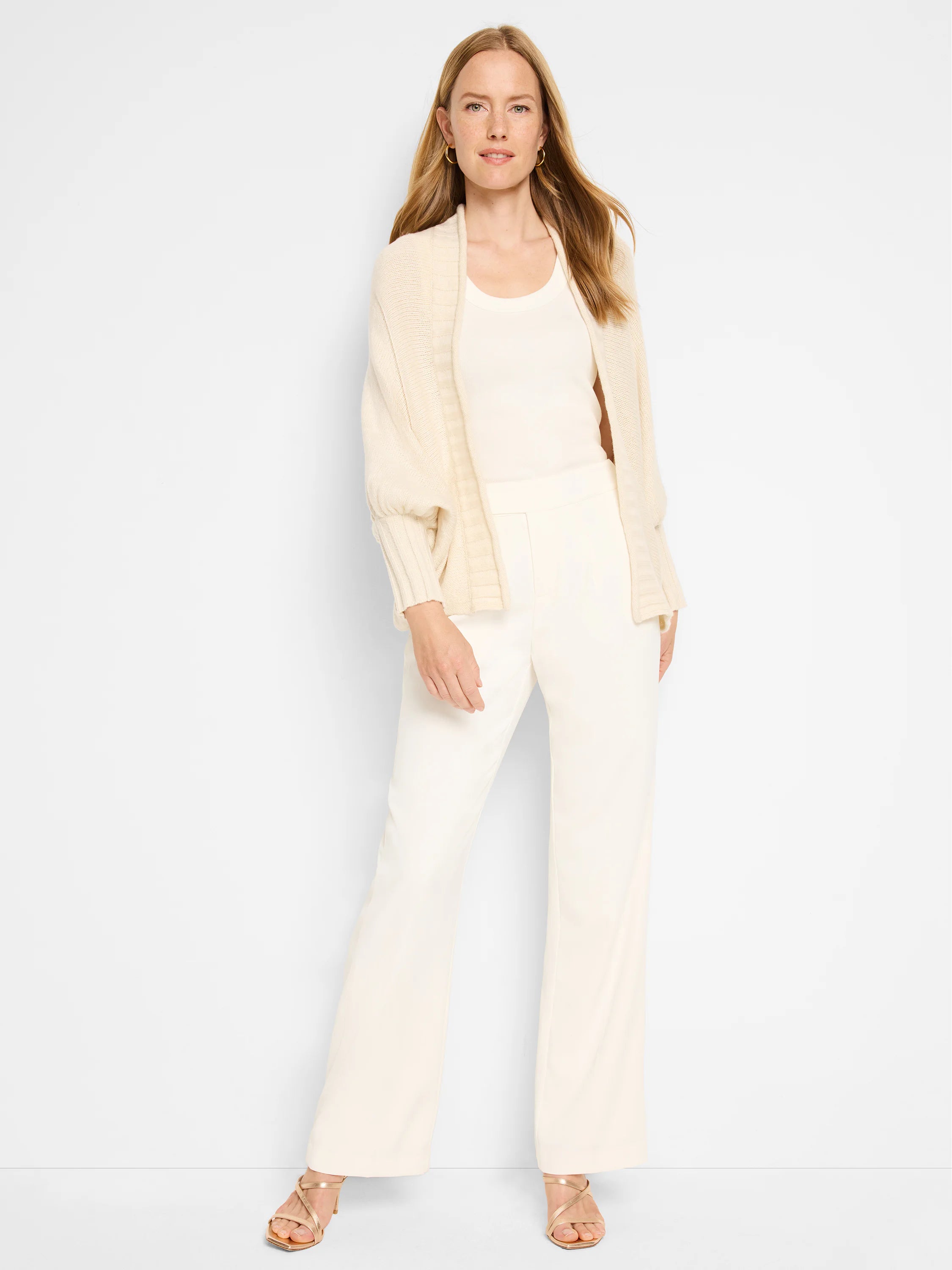 Off-white, open-front cardigan;  balloon sleeves, ribbed texture.