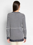 Cream and navy blue horizontal striped sweater.  Long sleeves, ribbed cuffs and hem.