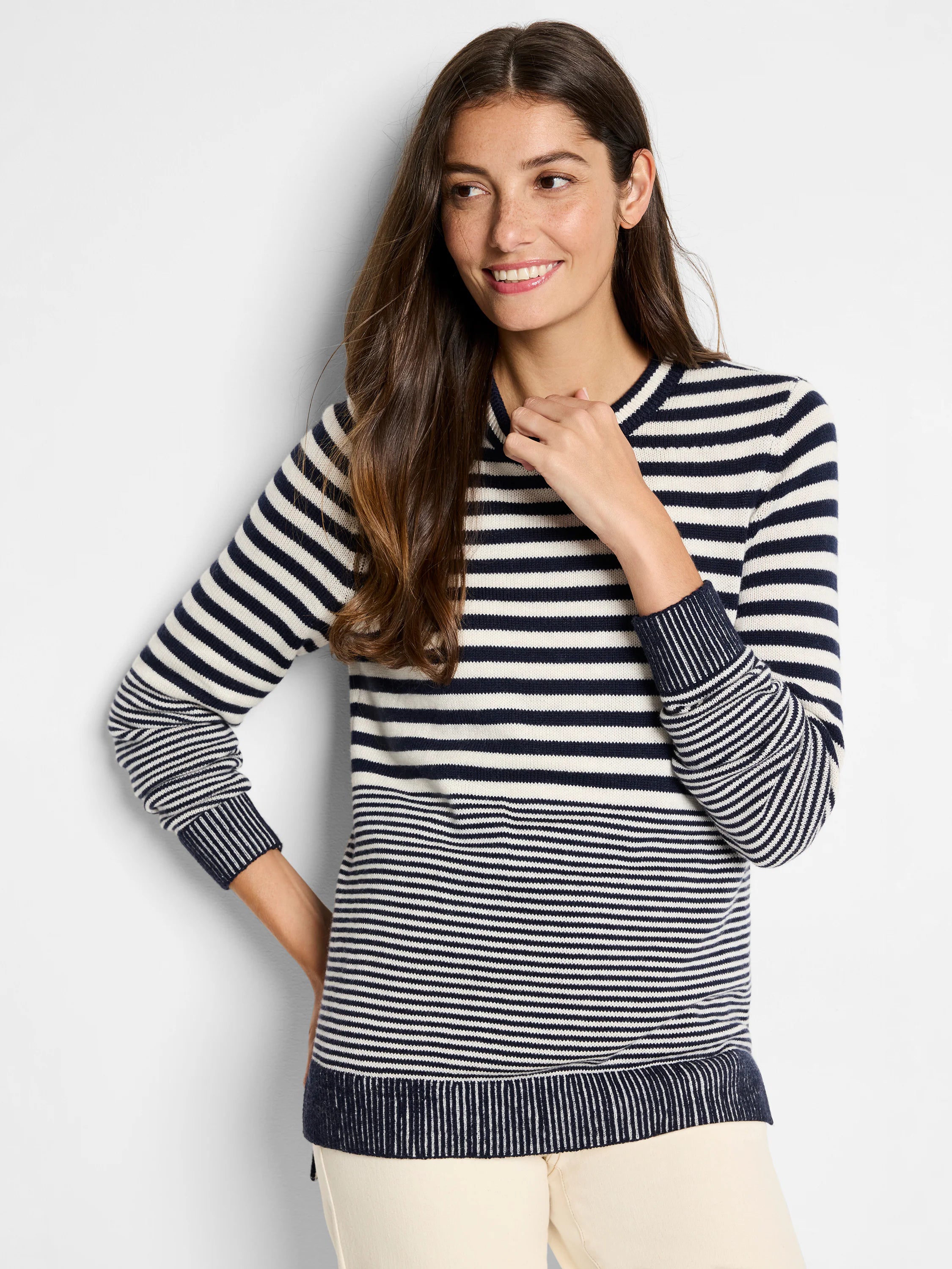 Navy and off-white horizontal striped sweater.  Crew neck, long sleeves, ribbed cuffs and hem.