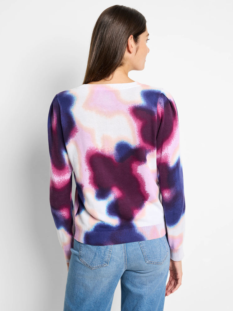 White sweater with a tie-dye pattern in shades of pink, purple, and blue.  Long sleeves, crew neck.