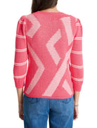 Pink sweater with white diagonal stripes and textured pattern.  Three-quarter sleeves.