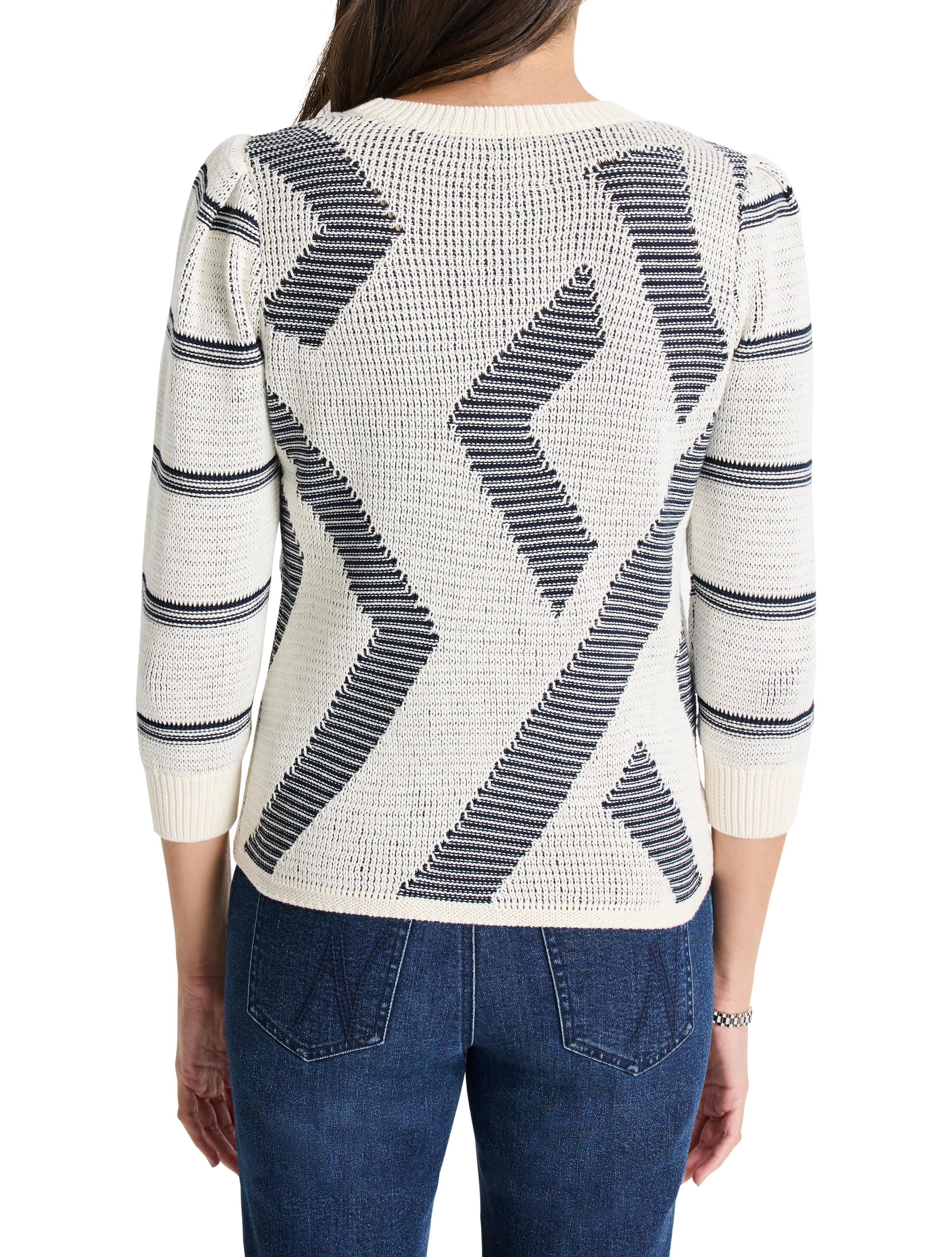 Cream-colored sweater with dark-blue, abstract, diagonal pattern.  Three-quarter sleeves.