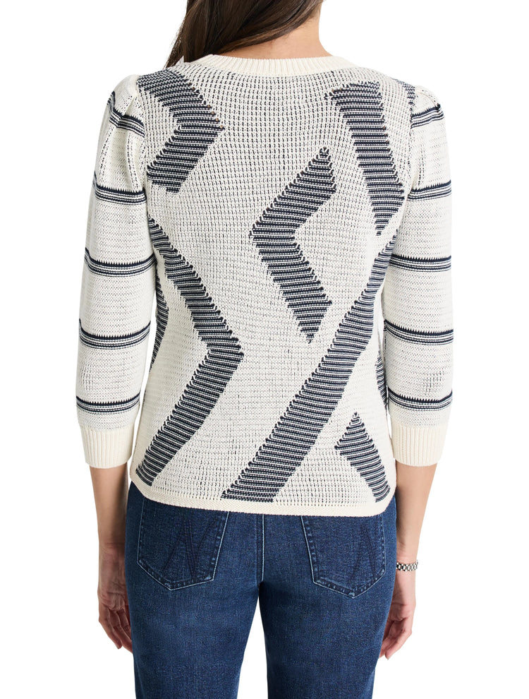 Cream-colored sweater with dark-blue, abstract, diagonal pattern.  Three-quarter sleeves.