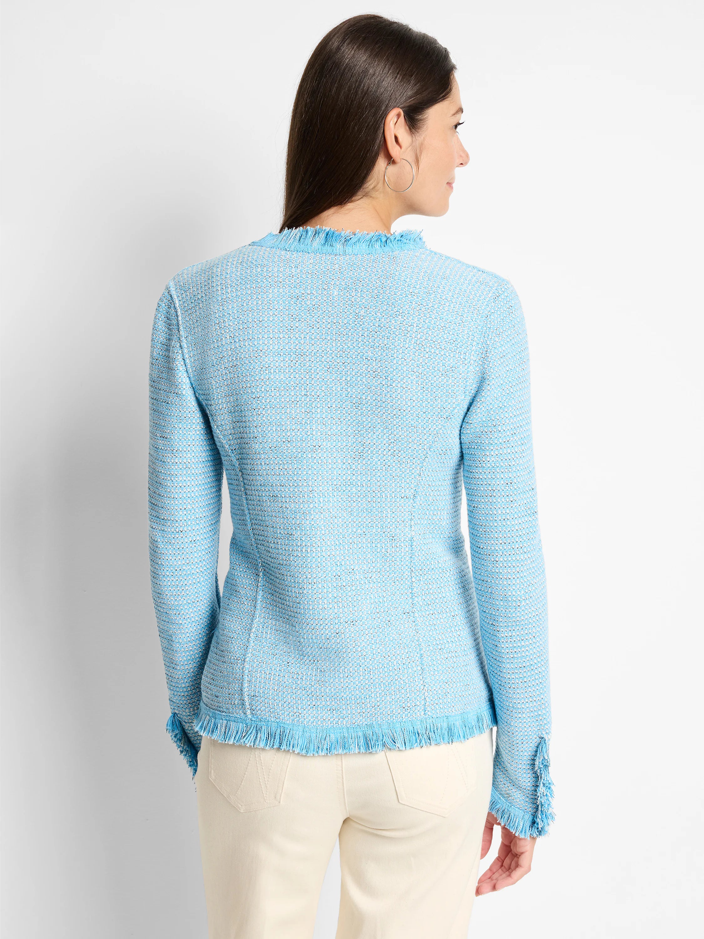 Light blue & white textured knit jacket with fringe trim at collar, hem, and cuffs. Back view on model.
