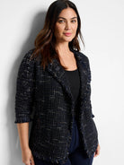Navy blue tweed jacket with subtle flecks of lighter blue and beige.  Fringed edges. Open front.