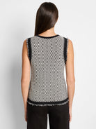 Black and off-white knit sleeveless tank top. Geometric pattern.  Frayed edges.