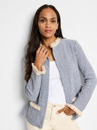 Blue and cream tweed jacket with frayed cream fringe trim at collar and sleeves.