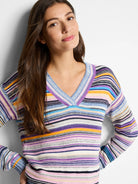 Multicolored striped V-neck sweater.  Includes purple, blue, pink, orange, and white stripes. Knit texture.