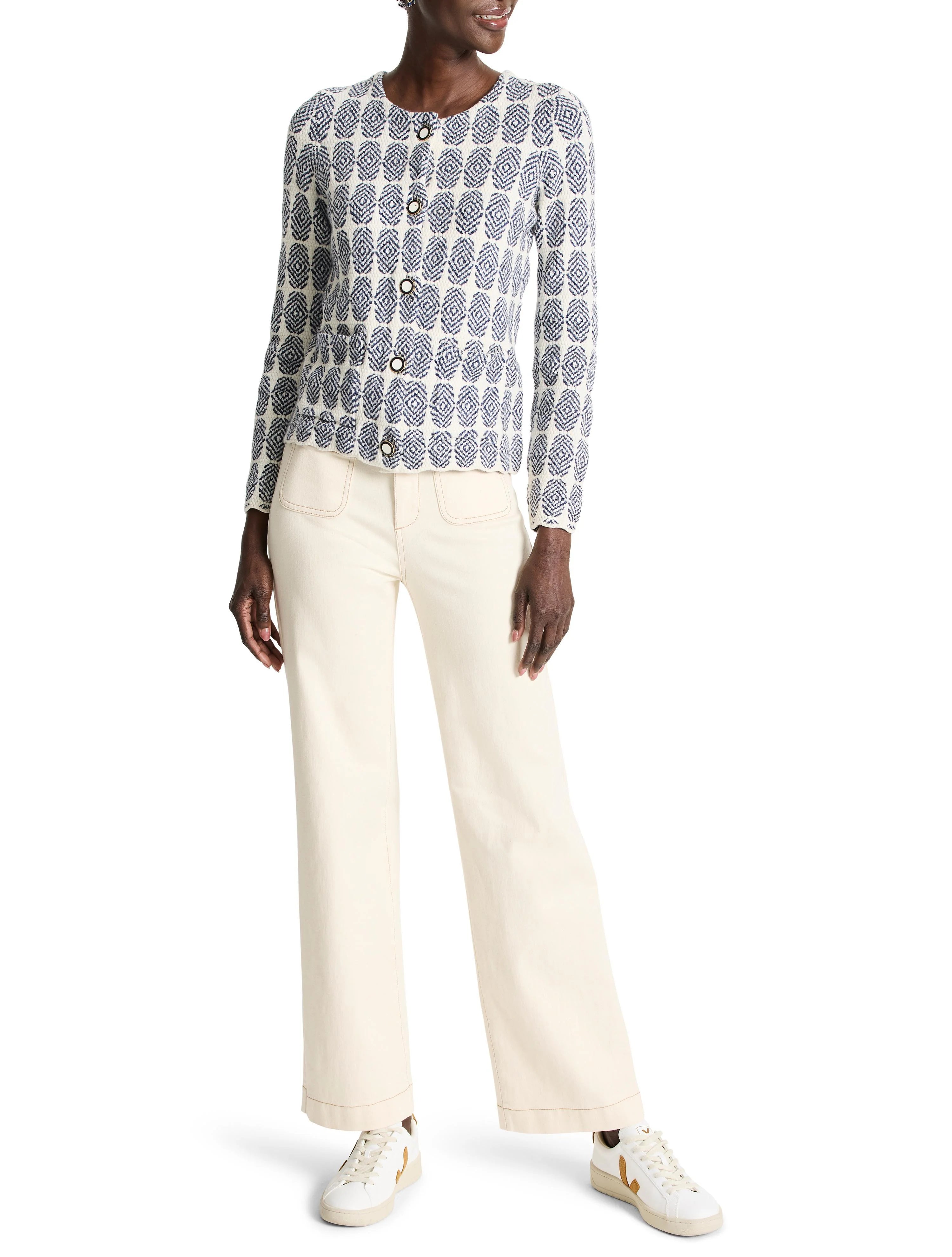 Cream-colored knit jacket with a navy blue geometric pattern, button closure.