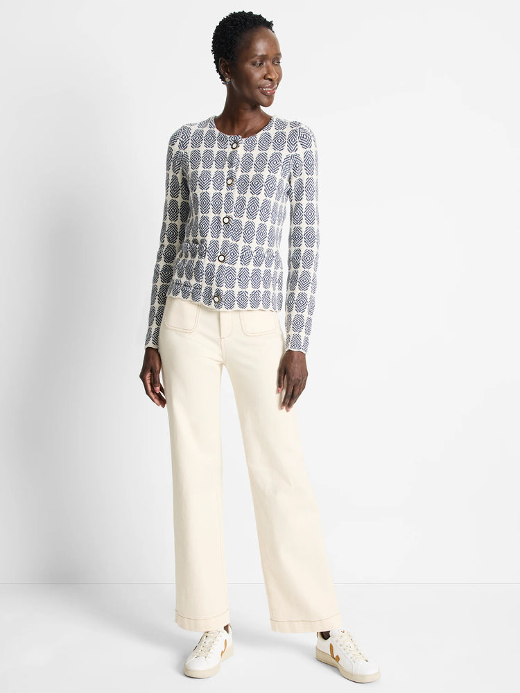 Off-white knit jacket with a navy blue geometric pattern, button closure.