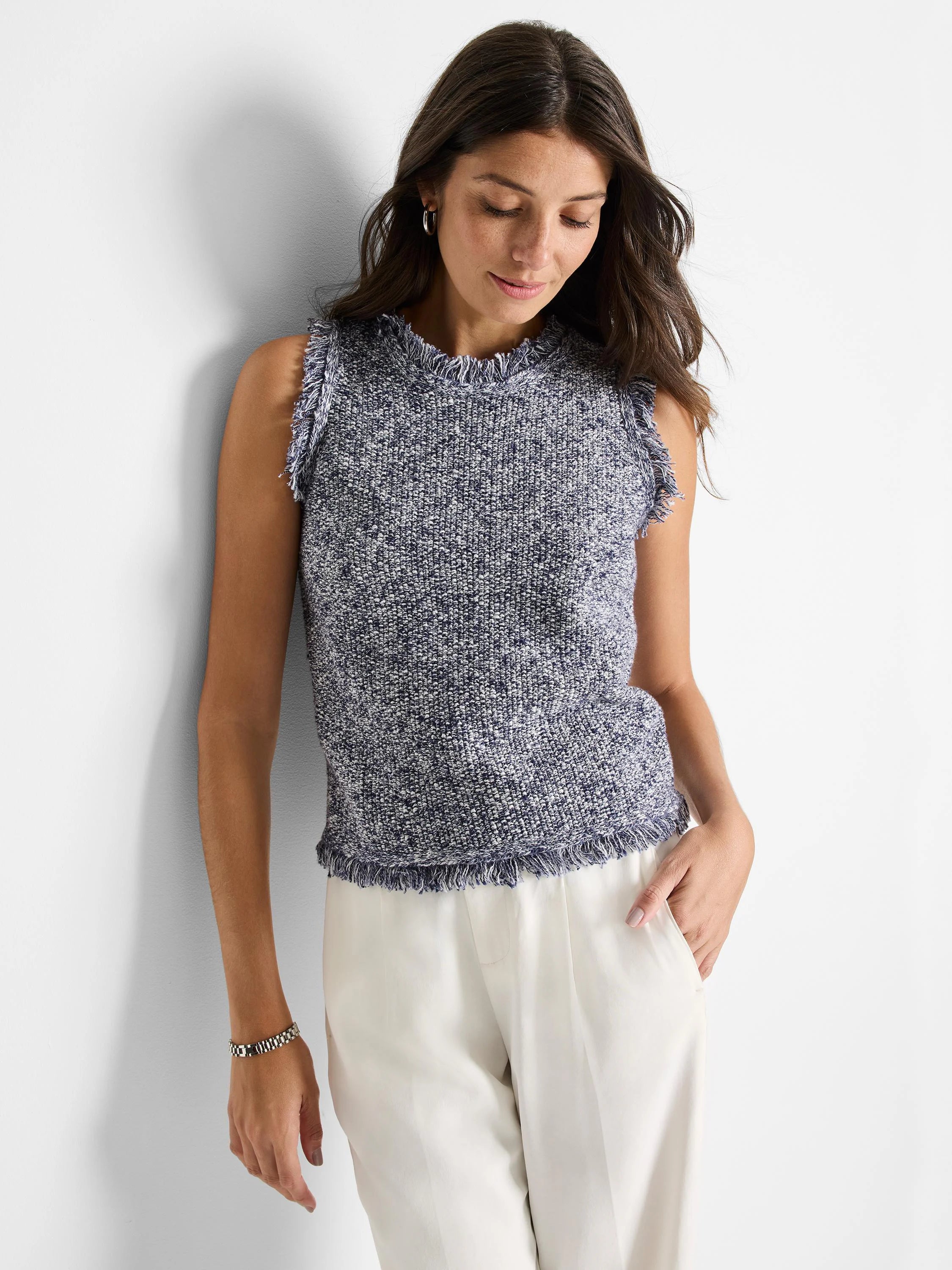 Sleeveless, navy and white speckled knit tank.  Features a frayed hem and armholes.