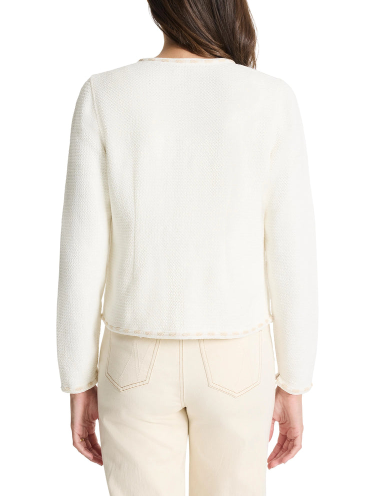 Off-white knit jacket with beige trim.  Long sleeves, textured fabric.  Shown from the back.