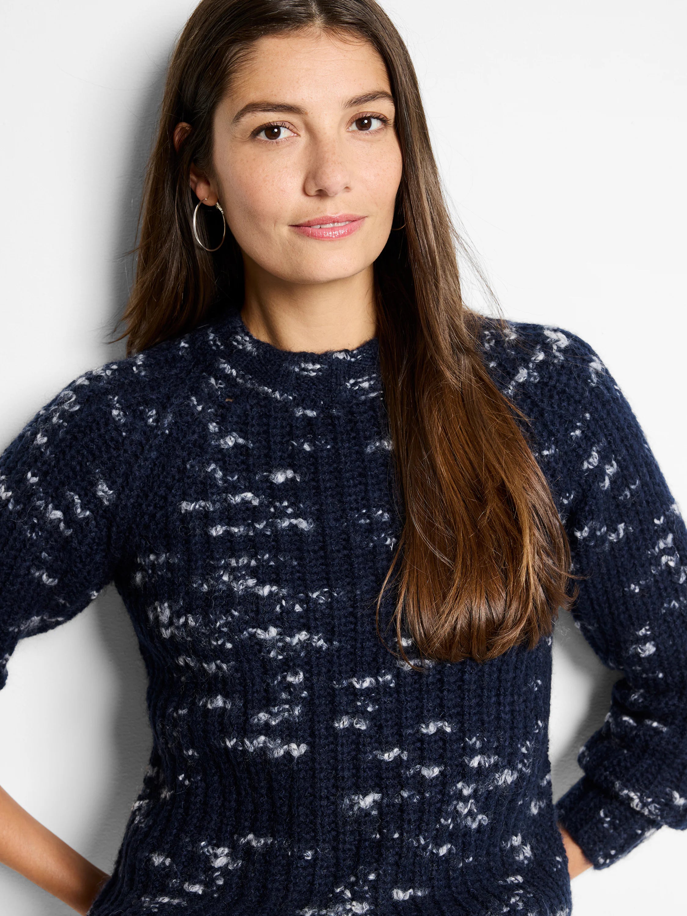 Navy blue sweater with a white flecked pattern, crew neck, and three-quarter sleeves.