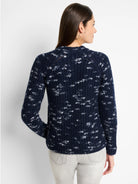 Navy blue sweater with a speckled white pattern, long sleeves, and a round neckline.