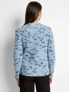 Light blue knit sweater with dark gray flecks;  ribbed texture.