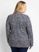 Navy blue blazer with an off-white grid pattern.  Long sleeves. Rear view.