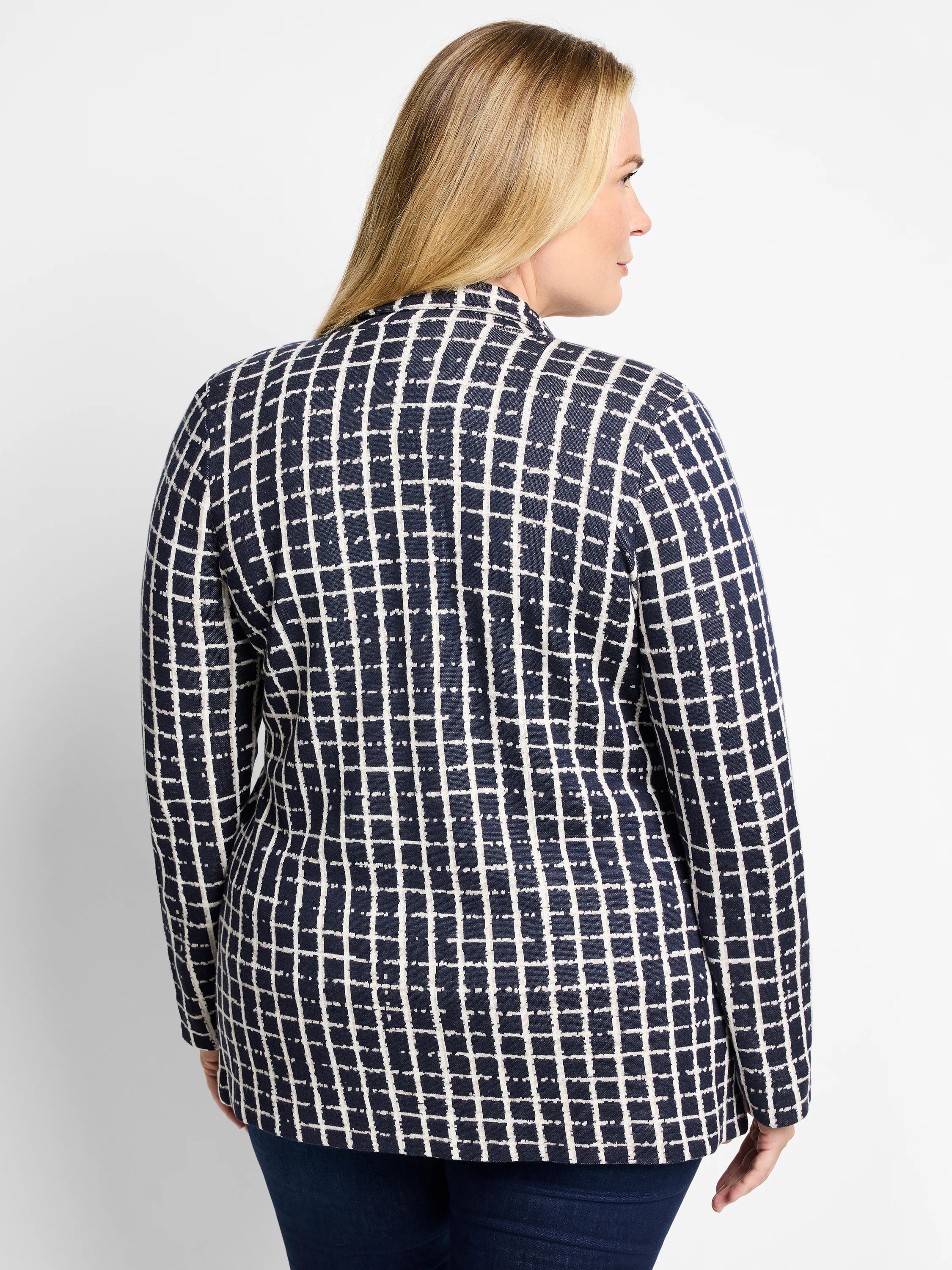 Navy blue blazer with an off-white grid pattern.  Long sleeves. Rear view.