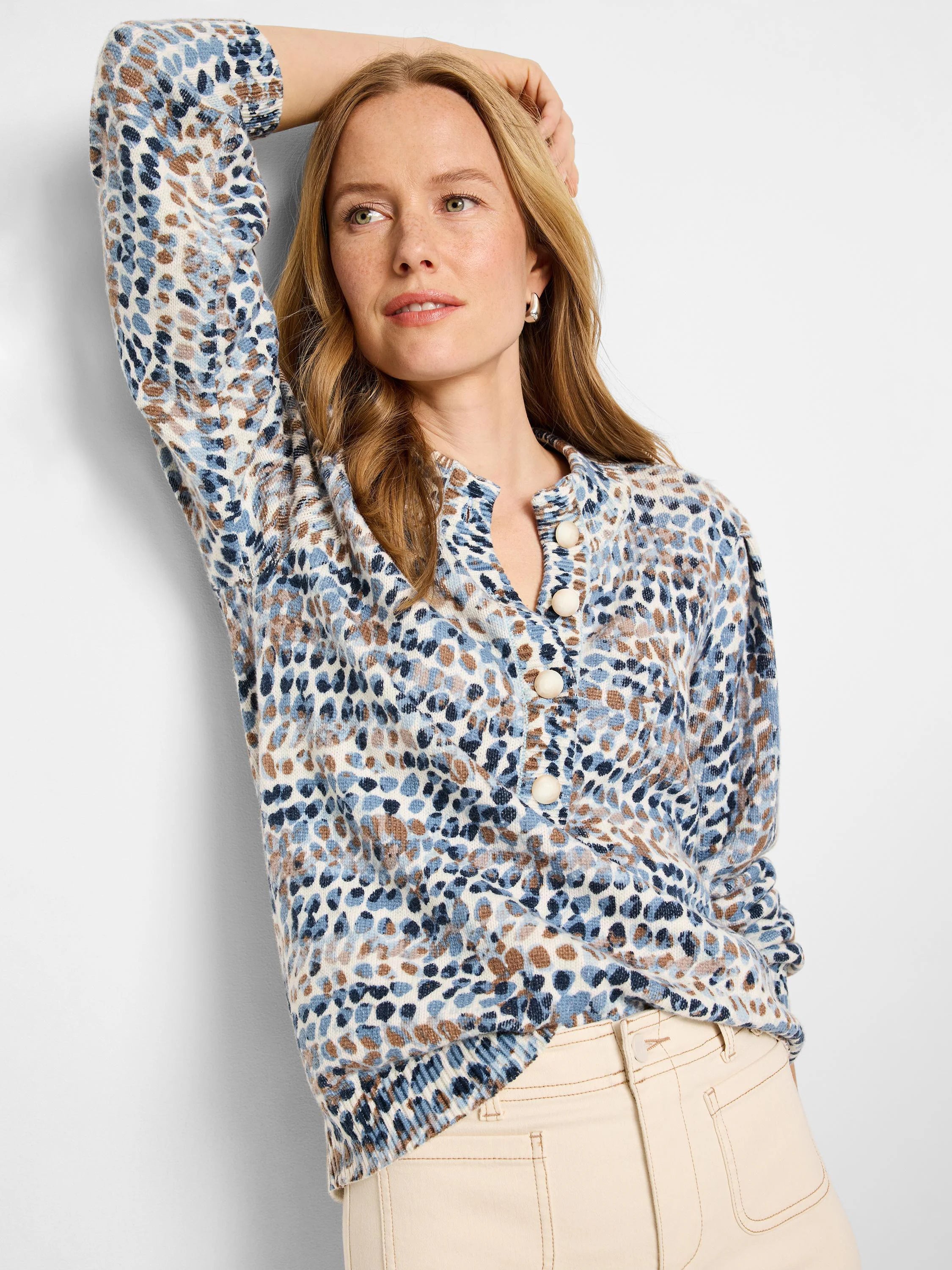 Henley sweater with blue, brown, and cream abstract print.  Button front. Long sleeves.