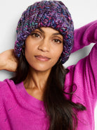 Image of fuchsia V-neck sweater.  Multicolored knit hat shows blues, purples, and pinks.