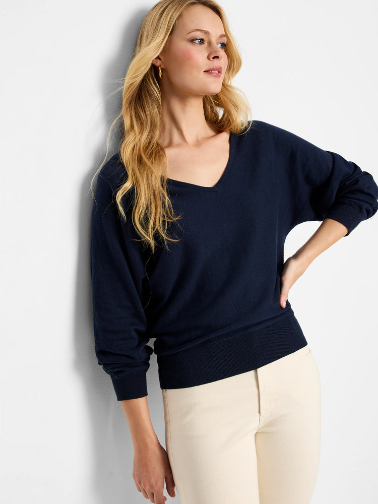 Navy blue dolman-sleeve sweater, V-neck.  Ribbed cuffs and hem.