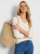 Off-white, long-sleeved v-neck sweater.