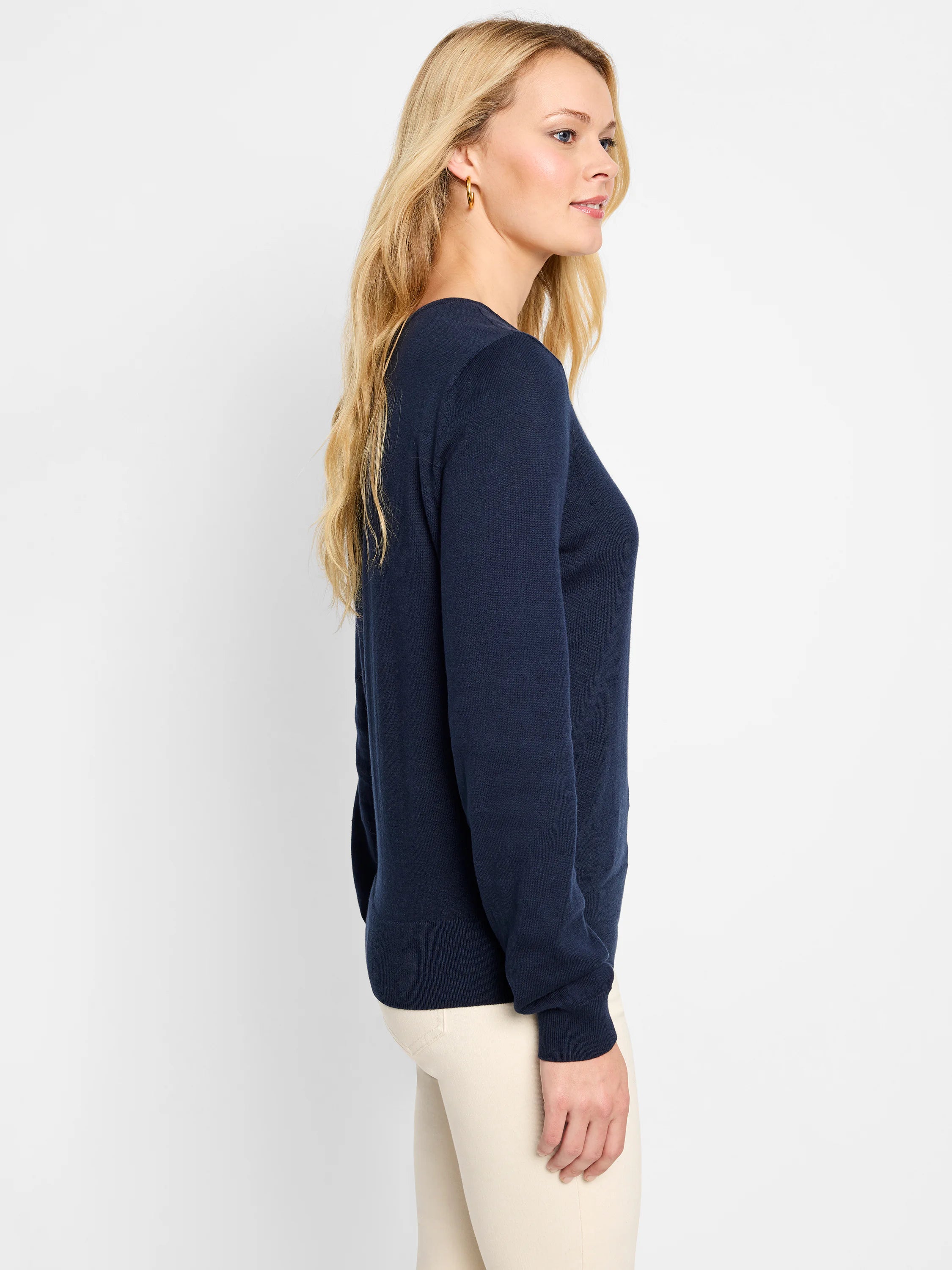 Navy blue, set-in sleeve sweater; long sleeves, v-neck.