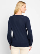Navy blue, long-sleeved knit sweater.  Set-in sleeves, straight hem.