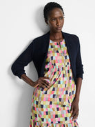 Navy blue mesh cardigan, short sleeves, open front.