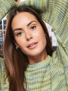 Variegated knit sweater: light green, pale yellow, muted blue. Ribbed crew neck.