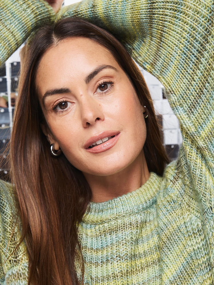 Variegated knit sweater: light green, pale yellow, muted blue. Ribbed crew neck.