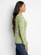 Crew neck sweater knit with variegated yarn in shades of lime green, sage, and subtle pale blue.