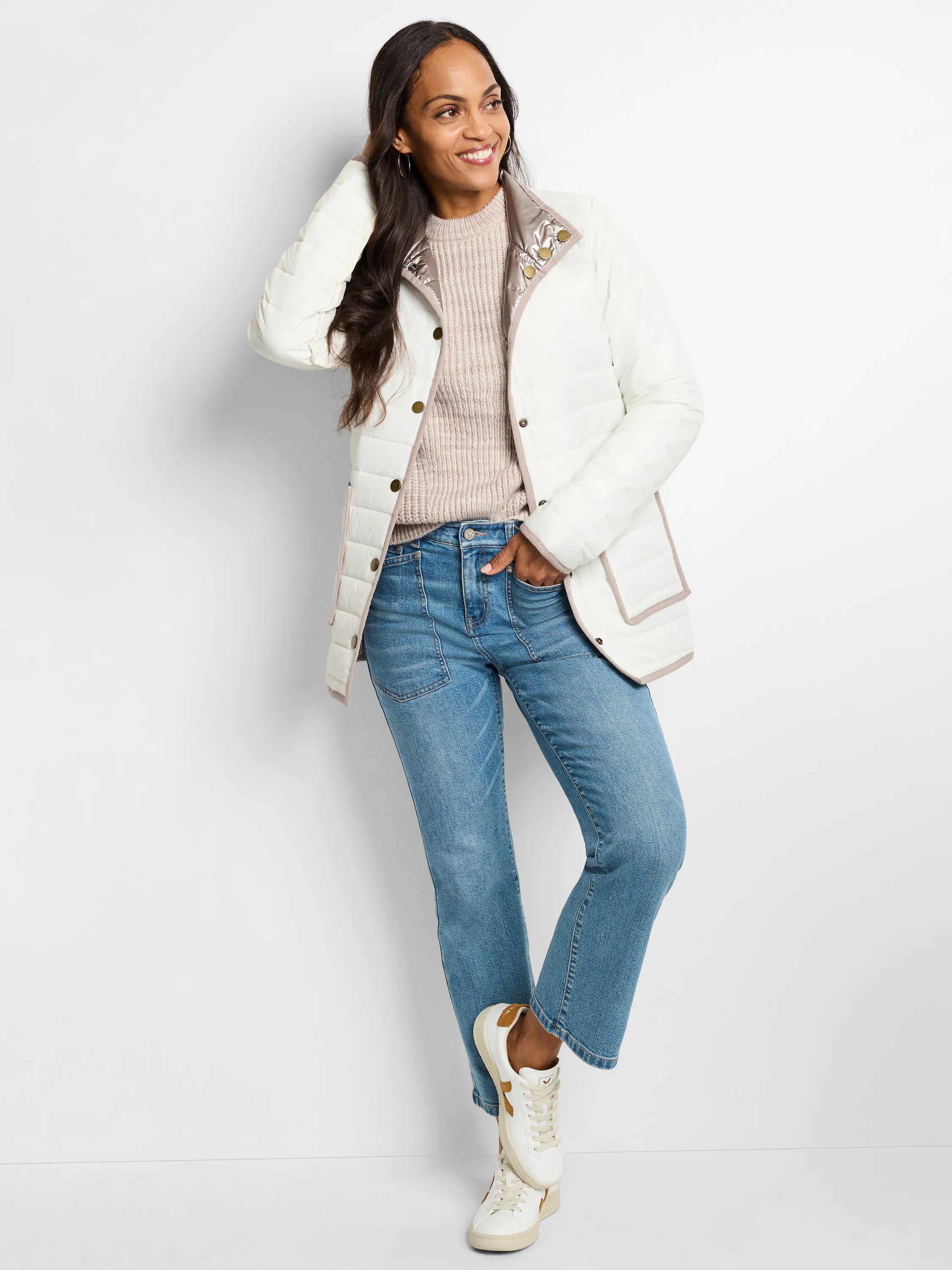 Off-white reversible puffer jacket with light brown trim, champagne inner collar, and gold snap buttons.