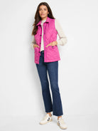 Cream waffle-stitch sweater with long sleeves and ribbed cuffs.