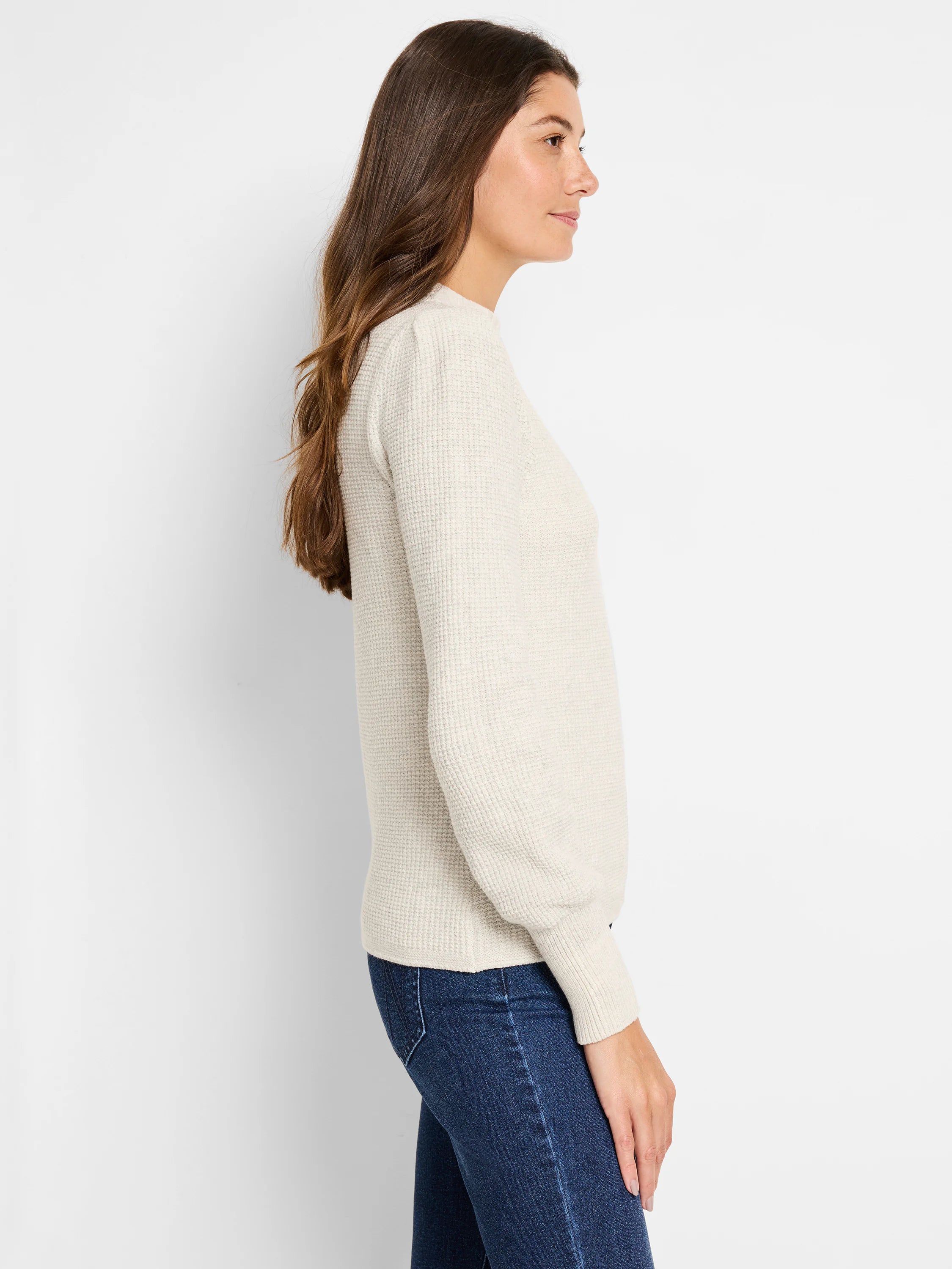 Cream waffle stitch sweater, long-sleeved, featuring a distinct textured pattern.