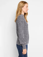 Model wears a marled blue & white waffle stitch sweater with a crew neck, long sleeves, relaxed fit.