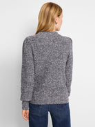Marled navy & white waffle stitch sweater with a mock neck, subtly puffed shoulders, and ribbed cuffs.