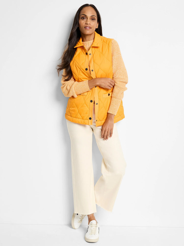 Pale orange, long-sleeved sweater with distinct waffle stitch texture.