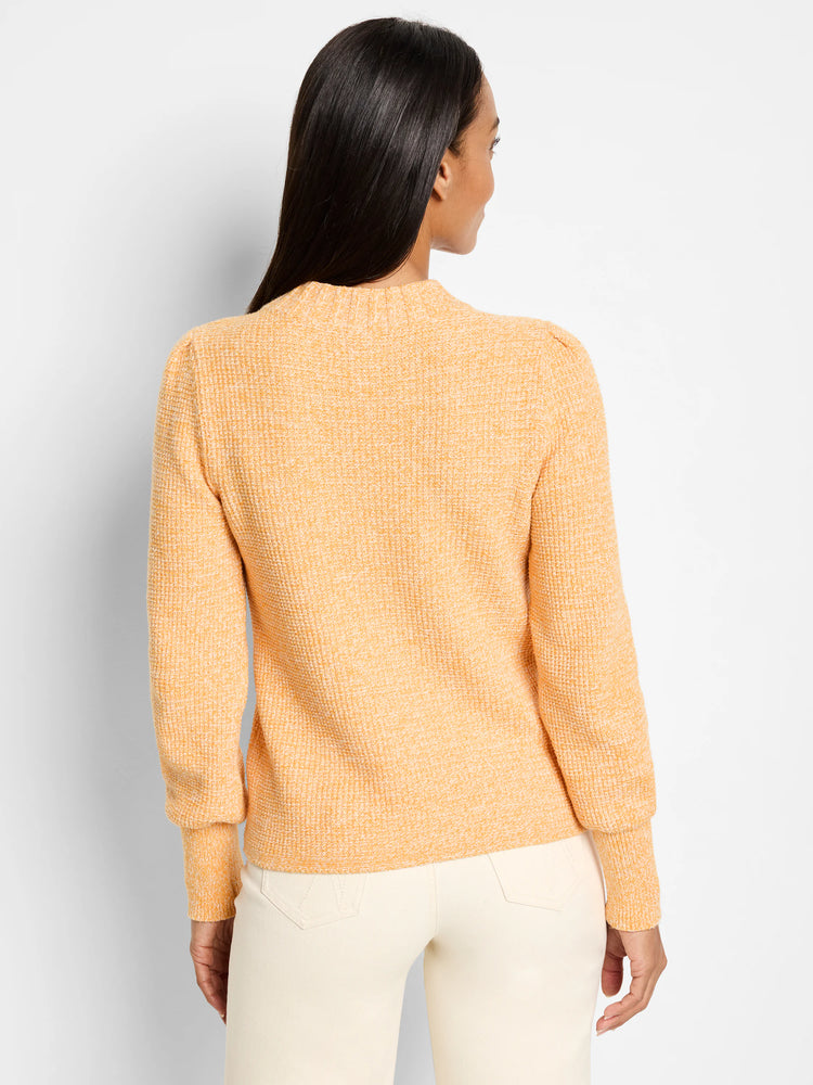 Peach waffle stitch sweater with ribbed mock neck, puff sleeves, and ribbed cuffs. Back view on model.