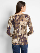 Long-sleeve, fitted sweater.  Beige, olive, and purple abstract camo pattern.