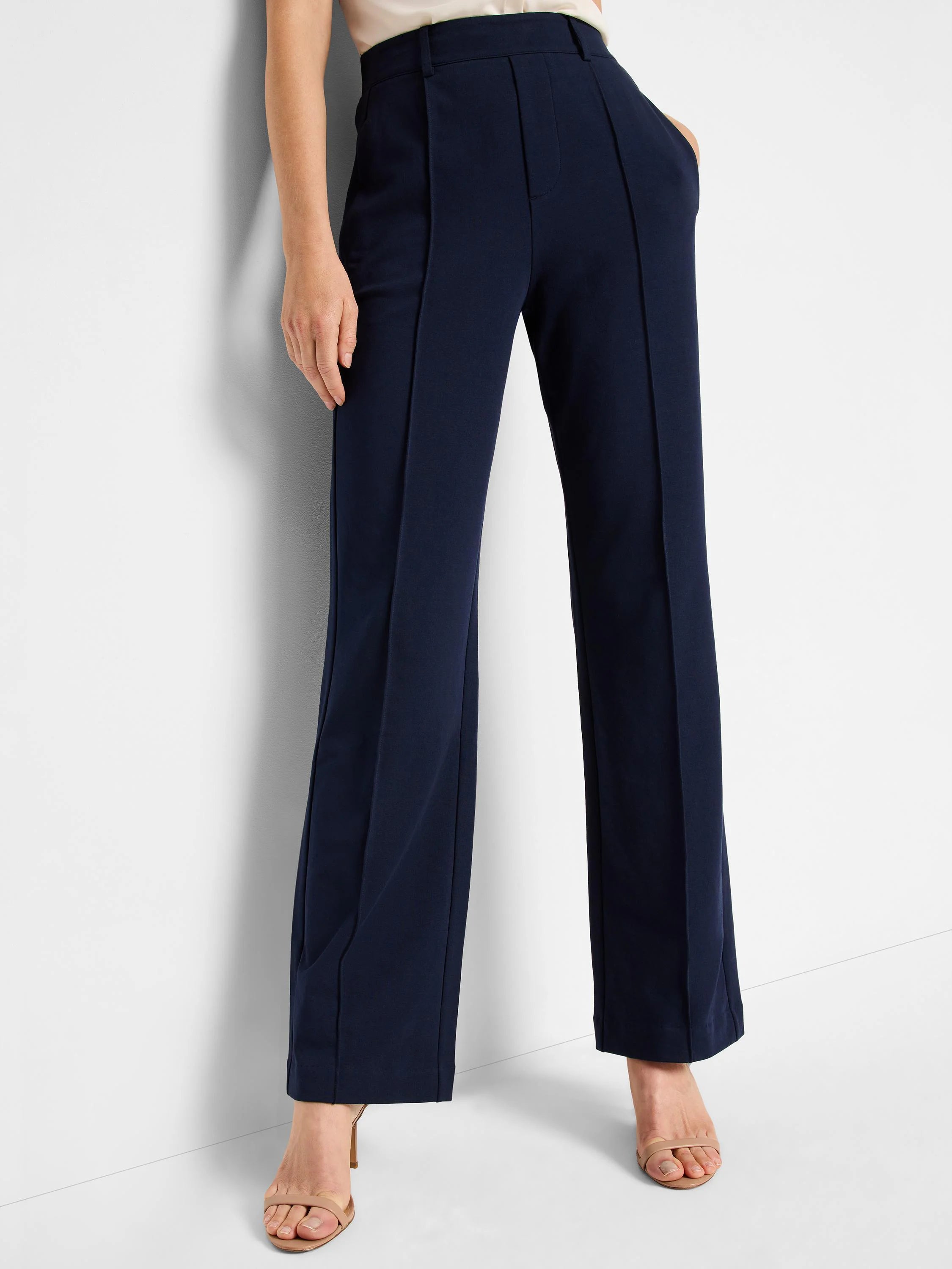 Navy blue, wide-leg pleated pants.  High-waisted with center pleats.