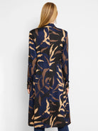 Navy, black, and tan leaf print midi trench coat with long sleeves and a cinched waist.