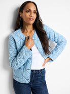 Light blue quilted denim jacket with dark stitching, button closures.  Diamond quilt pattern.