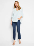 Light blue, 3/4 sleeve blouse;  curved hemline.