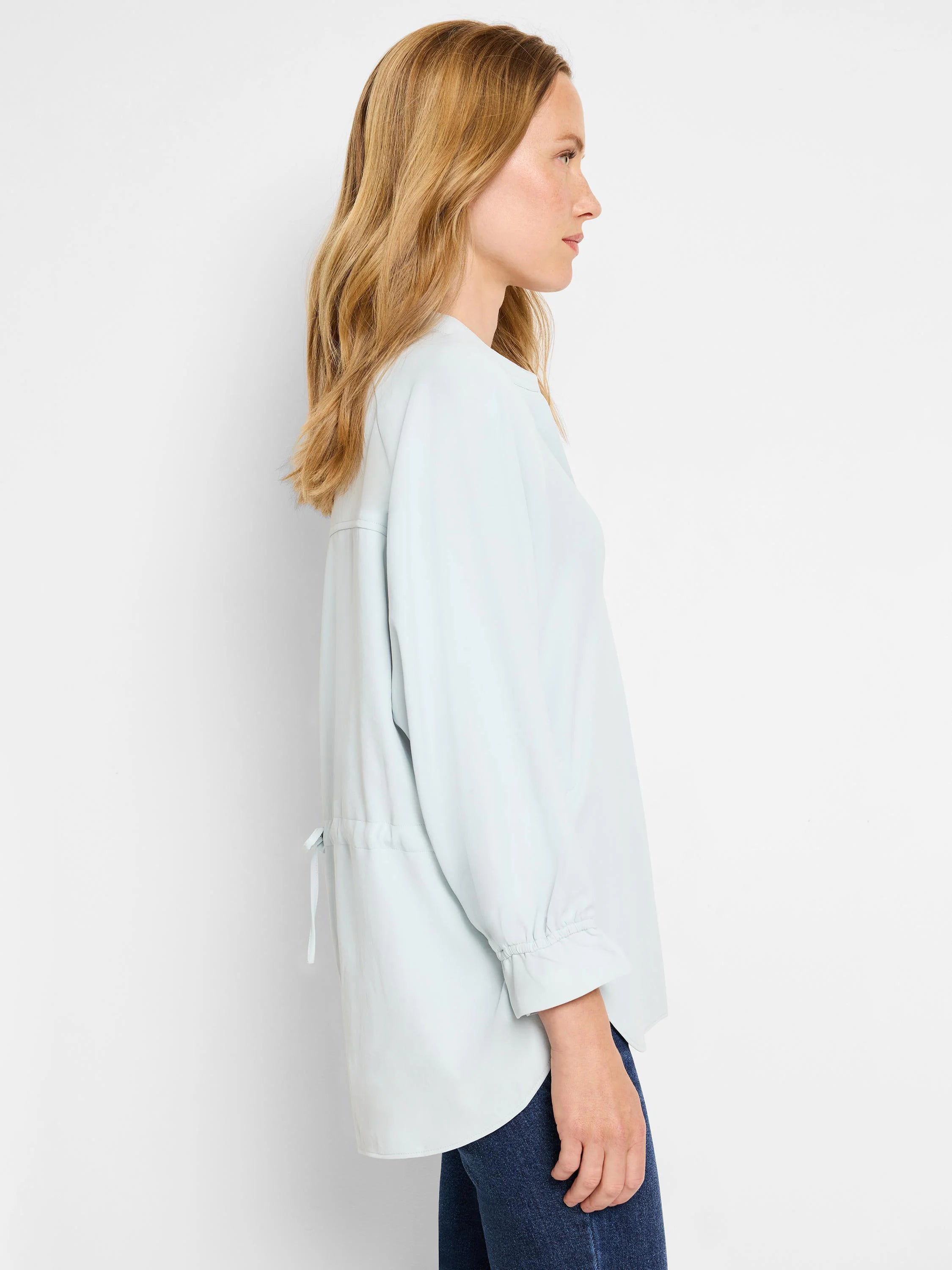 Light blue, 3/4 sleeve blouse with a slightly A-line shape and drawstring detail at the back.